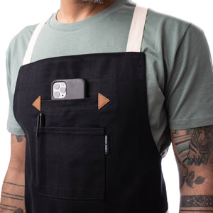 Apron with cell phone pocket and leather detailing